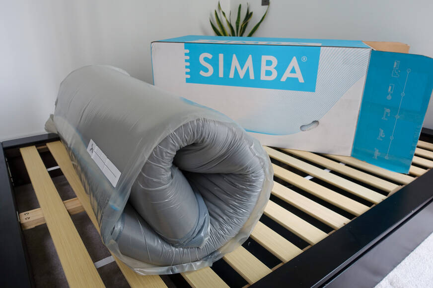 Simba Hybrid Essential mattress rolled up with box